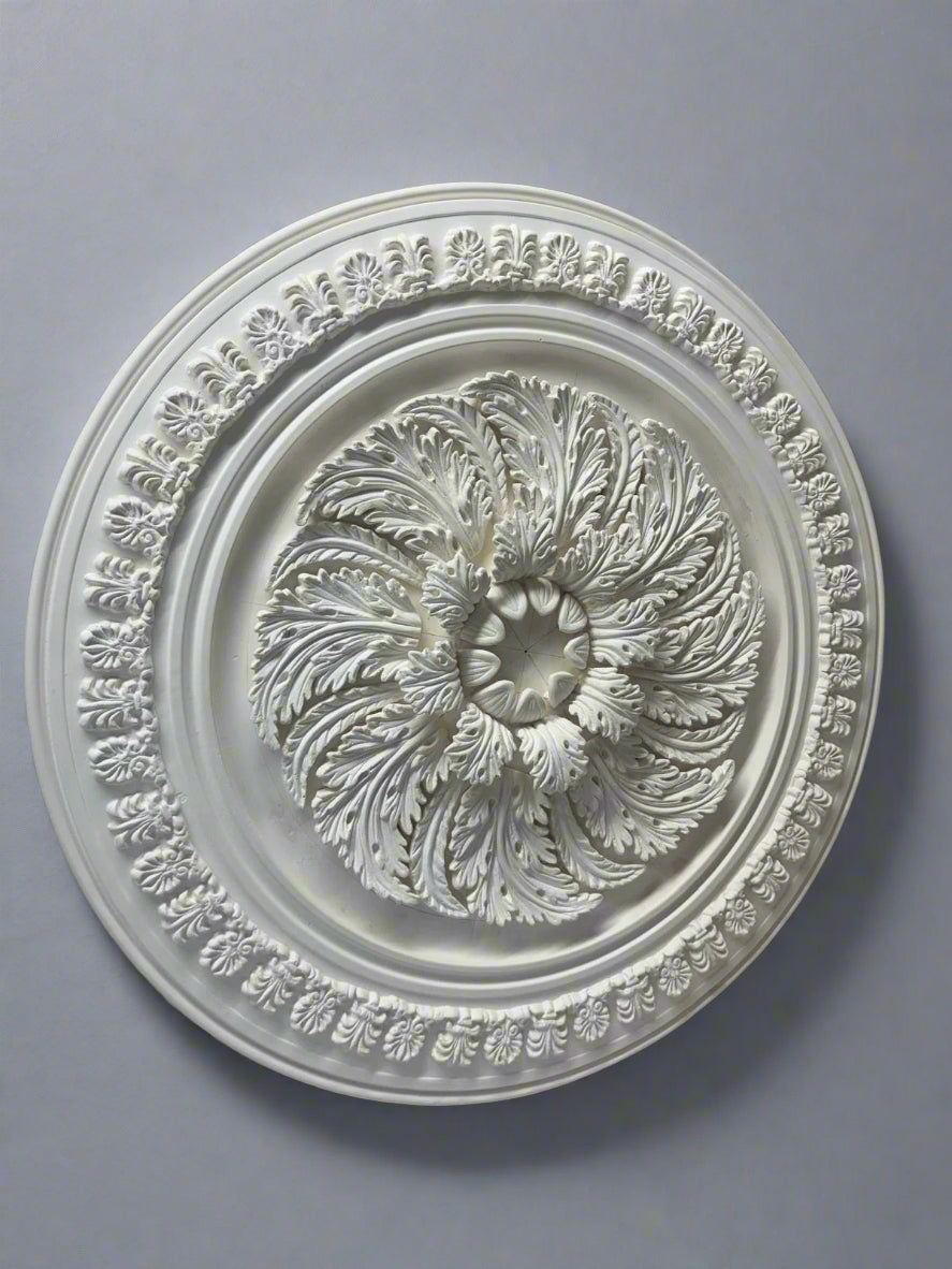 Decorative ceiling medallion on a workshop floor